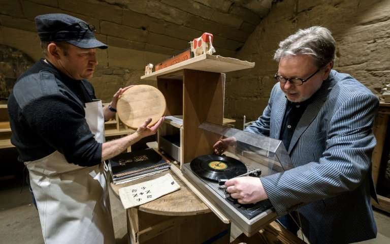 Swiss cheesemaker Beat Wampfler (L) and director of the Music Department at University of the Arts in Bern, Michael Harenberg. w