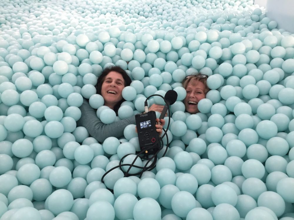 Host Robin Young and producer Karyn Miller-Medzon inside the massive ball pit at the Color Factory.