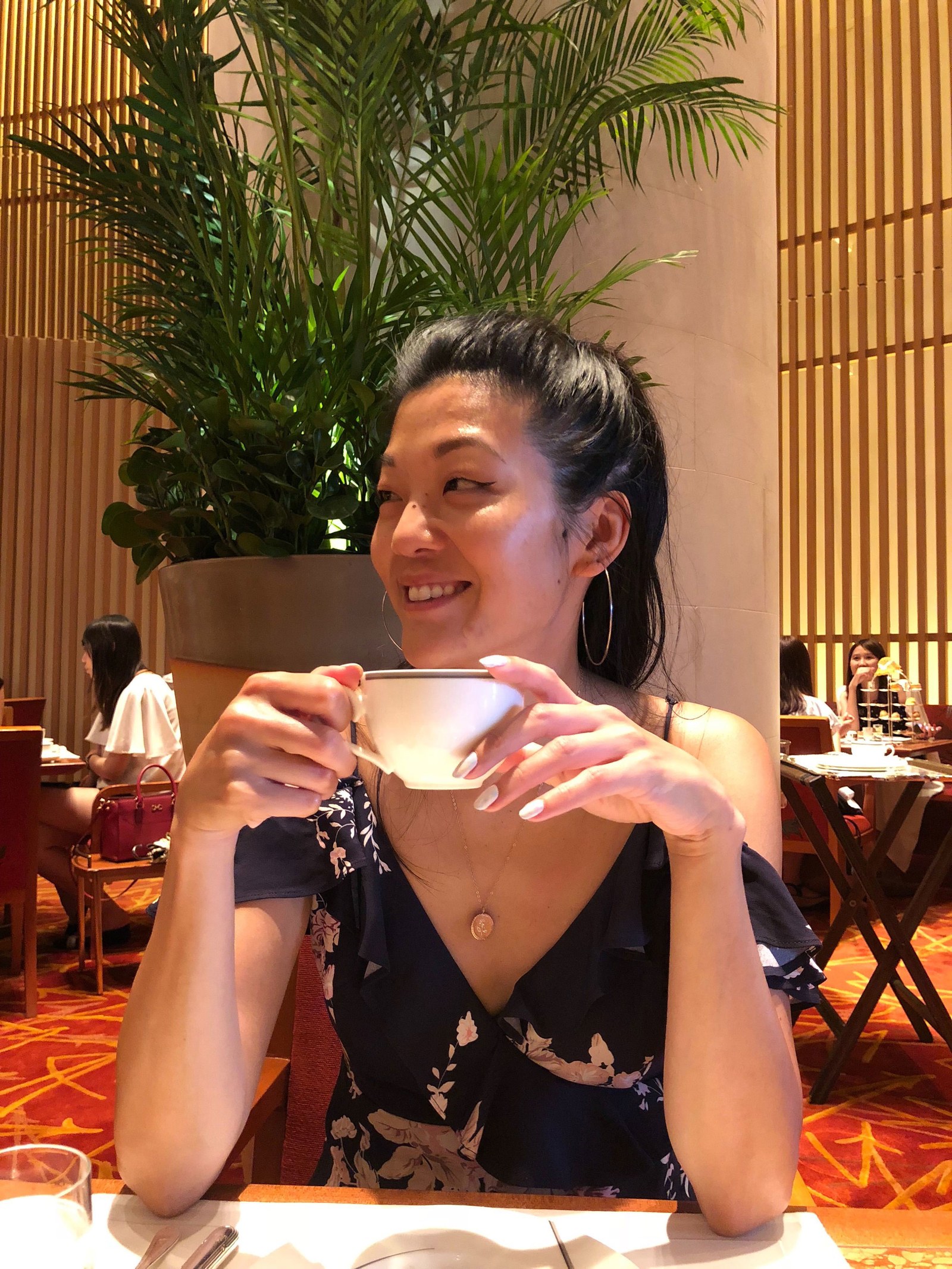 Michelle Lee with a cup of tea in hand in Tokyo