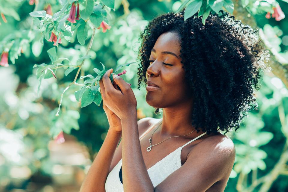 Smelling Flowers in Park