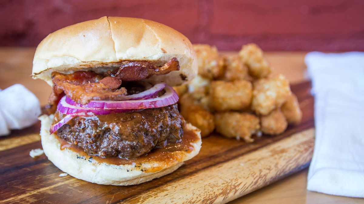BBQ Bus’s new Brookland location has a to-go bacon burger with tots.