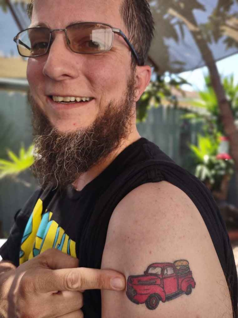 Contest participant Jim Ceja showing off his Farmer Boys tattoo.